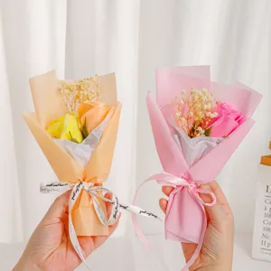 Detailed close-up of mini rose and gypsophila dry flower bouquets, great gift for graduation.