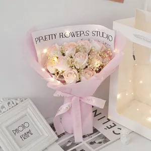 Detailed view of pink soap rose bouquet with fairy lights, romantic gift scene for lovers.