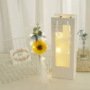Romantic sunflower rose bouquet gift set with glowing LED light bag for Valentine's Day.