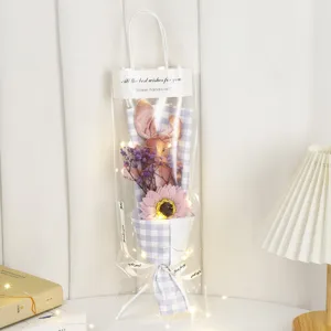 Valentine's Day plush rabbit flower bouquet gift bag with sunflower and fairy lights.