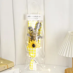 Detailed view of the cute rabbit doll dried flower bouquet with sunflower and warm lights.