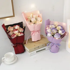 Artificial rose bouquet with fairy lights and gypsophila, romantic gift for valentine day.