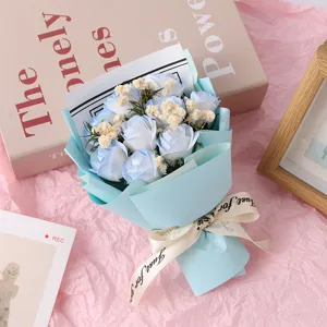 Detail view of a 9-head blue soap rose mini dried flower bouquet with elegant wrapping paper.
