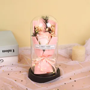 Detailed view of eternal soap rose in glass dome with led lights romantic gift for lovers.