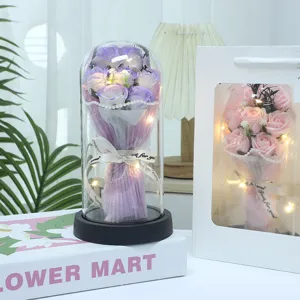 Eternal rose soap flower in glass dome with led lights, romantic gift detail display.