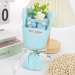 Mini knitted crochet flower bouquet detail, handmade wool floral gift, cute desk decor option.