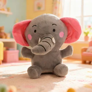 Adorable gray elephant plush toy with soft pink ears, cute facial details and cozy sitting pose.