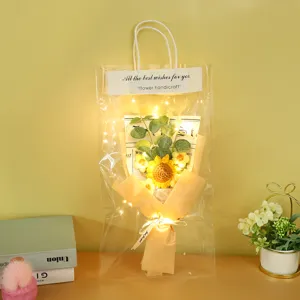 Handmade knitted sunflower bouquet gift bag with warm string lights for romantic occasions.