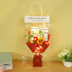 Handmade crochet sunflower bouquet in clear gift bag with LED fairy lights detail display.