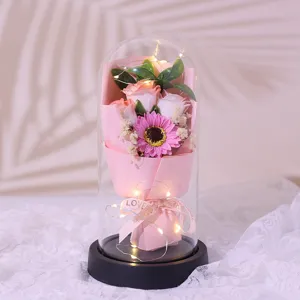 Exquisite glass dome eternal flower gift with romantic LED fairy lights for romantic occasions.