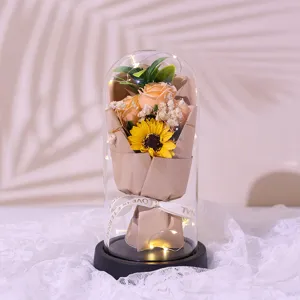 Exquisite glass dome eternal flower ornament detail featuring rose and sunflower with LED lights.