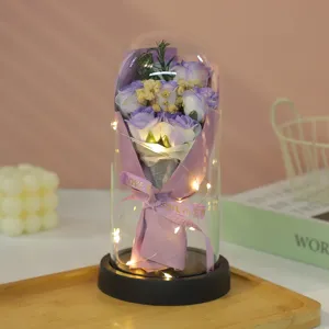 Glass dome preserved rose soap flower bouquet with LED lights for romantic gift and decor.