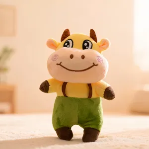 Cute 7-inch standing cow plush toy, soft stuffed doll in green shorts for gifts wholesale.