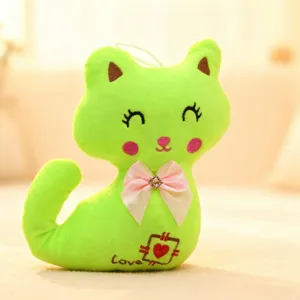 Cute green cat plush toy with pink bow and heart embroidery, soft stuffed animal doll detail.