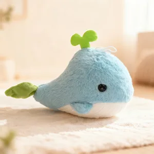 Cute cartoon blue whale plush toy with green sprout detail soft stuffed animal doll for kids