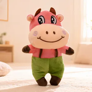 Cute plush cow stuffed toy doll, soft pink animal figure with green pants for kids gift wholesale.