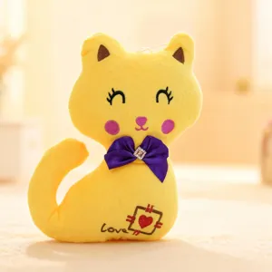 Detailed close-up of the cute yellow plush cat toy featuring a soft texture and purple bow.