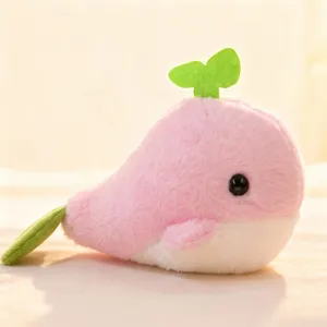 Cute pink whale plush toy close-up showing soft fabric texture, sweet stuffed animal doll for kids.