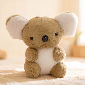 Cute plush koala stuffed animal toy detail, soft brown and white toy close up view.