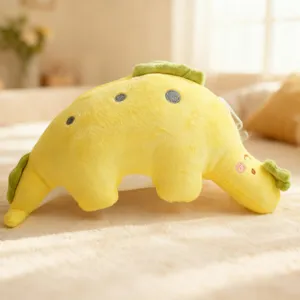 Soft yellow dinosaur plush toy detail, cute stuffed animal doll for kids and home decor pillow.