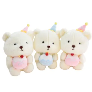 Cute 8-inch plush bear toy holding mini cake, soft stuffed animal claw machine doll for kids.