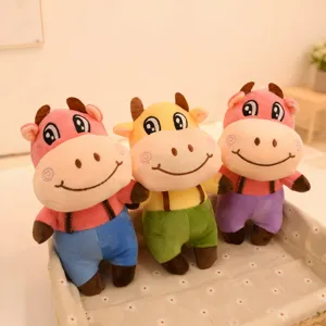 Cute 7-inch plush cow doll toy, stuffed cartoon animal in overalls for claw machine gifts.
