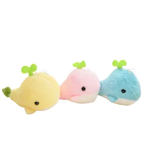 Cute cartoon whale plush toy doll with green sprout design, soft hanging keychain pendant.