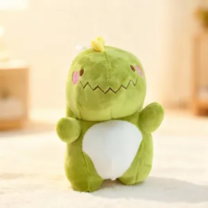 Cute green dinosaur plush toy detail showing soft fabric and embroidered facial features.