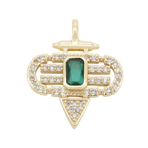 Close-up detail of gold plated DIY jewelry pendant with green stone and clear zirconias.