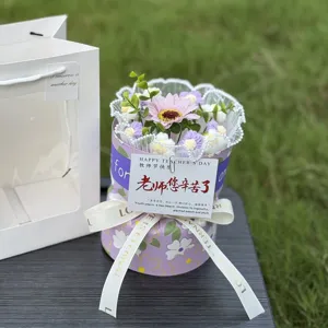 Handmade crochet flower bouquet in gift box, detailed view of knitted floral arrangement.