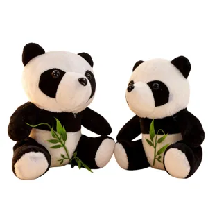 Cute plush panda toys pair sitting together holding bamboo branches, perfect gift and decor.