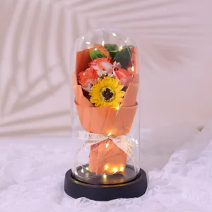 Glass dome artificial soap rose bouquet with LED string lights for romantic Valentine's Day gift.