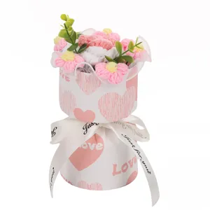 Handmade knitted crochet flower bouquet in heart pattern gift box with ribbon for romantic gift.
