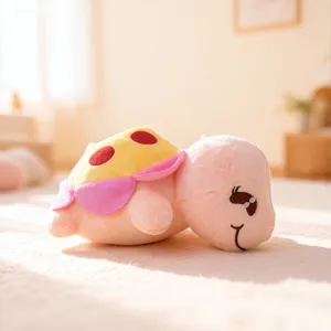 Detailed view of a cute plush turtle toy with a colorful shell, soft pink body, and sweet smile.