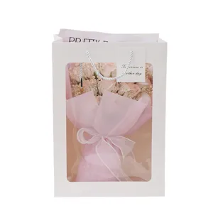 White gift bag with soap rose bouquet, perfect romantic present for Valentine's Day.
