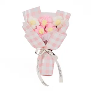 Handmade knitted crochet flower bouquet with pink plaid wrapping for Valentine gift.
