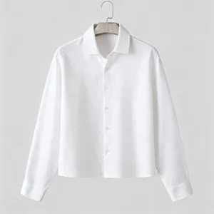 Detail view of a men textured white long sleeve button up shirt with lapel collar and relaxed fit.