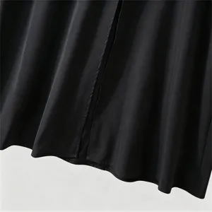Men's formal suit jacket detail showing smooth black fabric, fine stitching and sleek hem line.