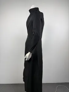 Details of black men standing collar long suit coat, slim waist A-line banquet dress.