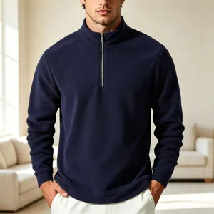 Detail view of men's navy blue fleece half-zip sweatshirt, cozy stand-up collar design.