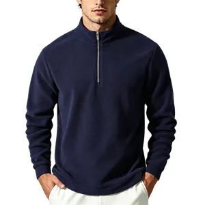 Close-up detail of the cozy fleece fabric and convenient half-zip stand collar design.