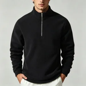 Close-up detail of the metal zipper and soft fleece fabric on the black men's half-zip collar.