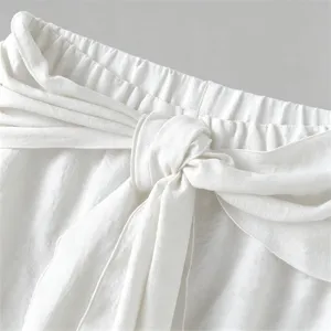 White casual pants waist detail, stylish front tie knot and layered design for men.