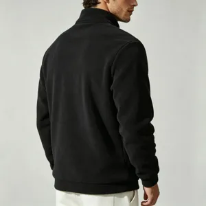 Men's black fleece half-zip jacket detail, stand collar design, cozy and warm casual wear.