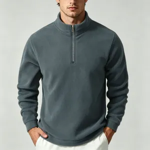 Dark grey quarter-zip fleece pullover detail shot showing high collar and soft texture