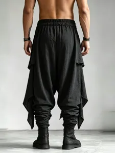 Men's black drop-crotch harem pants with layered drape panels and cuffed hem streetwear.