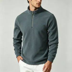 Detail view of men's dark gray fleece half zip pullover sweatshirt with stand collar.