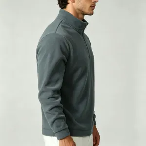 Side detail view of a men's dark gray fleece half-zip stand collar pullover sweatshirt.