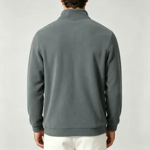 Detail view of men's dark gray fleece half zip pullover back design showing cozy fabric texture.