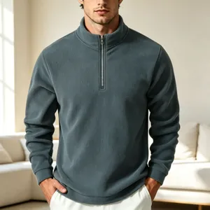 Close-up view of men's fleece quarter-zip sweatshirt detail, soft texture and stand collar.